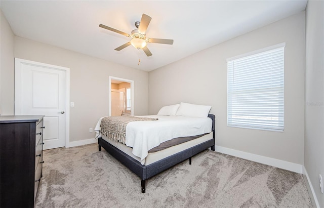 2653 Longleaf Pine Pt, New Port Richey, FL 34655 - bedroom featuring light colored carpet, ceiling fan, and ensuite bathroom
