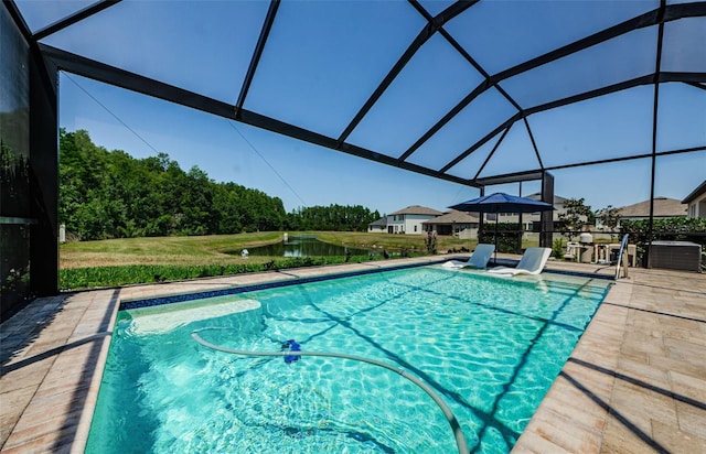 2653 Longleaf Pine Pt, New Port Richey, FL 34655 - outdoor pool featuring a water view, a lanai, and a patio
