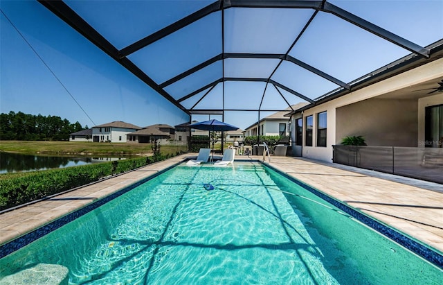2653 Longleaf Pine Pt, New Port Richey, FL 34655 - outdoor pool with a patio, a water view, a lanai, and a ceiling fan
