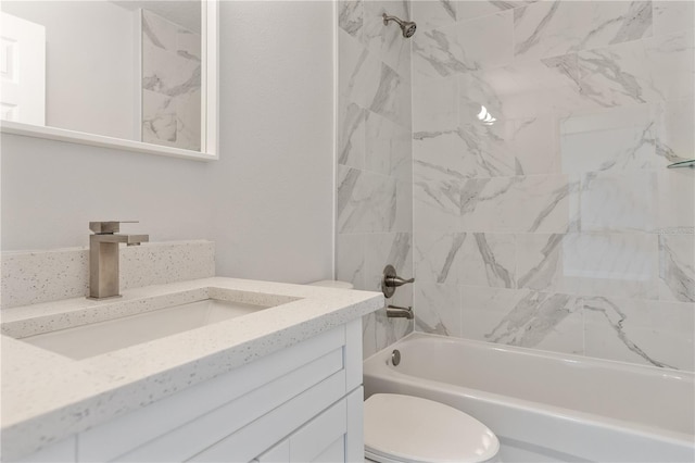 bathroom featuring vanity, shower / bathtub combination, and toilet