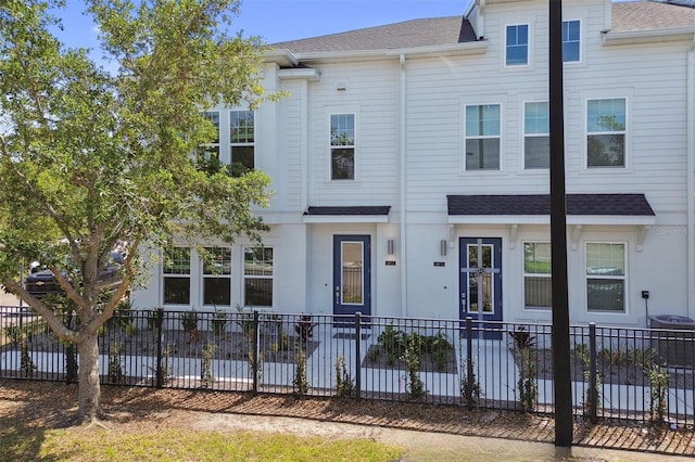 4717 W Mccoy St Unit 2, Tampa, FL 33616 - multi unit property with roof with shingles and fence