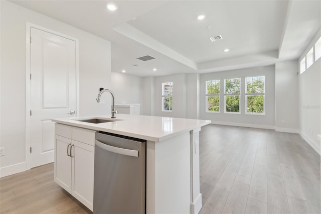 4717 W Mccoy St Unit 2, Tampa, FL 33616 - kitchen featuring stainless steel dishwasher, a sink, a tray ceiling, open floor plan, and light wood-style flooring