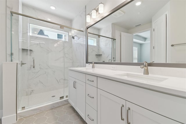4717 W Mccoy St Unit 2, Tampa, FL 33616 - full bathroom with a marble finish shower, tile patterned flooring, double vanity, and recessed lighting