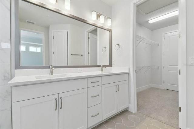 4717 W Mccoy St Unit 2, Tampa, FL 33616 - full bath with double vanity, a spacious closet, and tile patterned flooring
