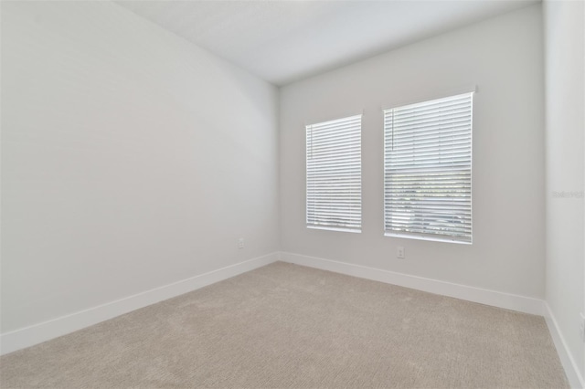 4717 W Mccoy St Unit 2, Tampa, FL 33616 - unfurnished room with light carpet and baseboards