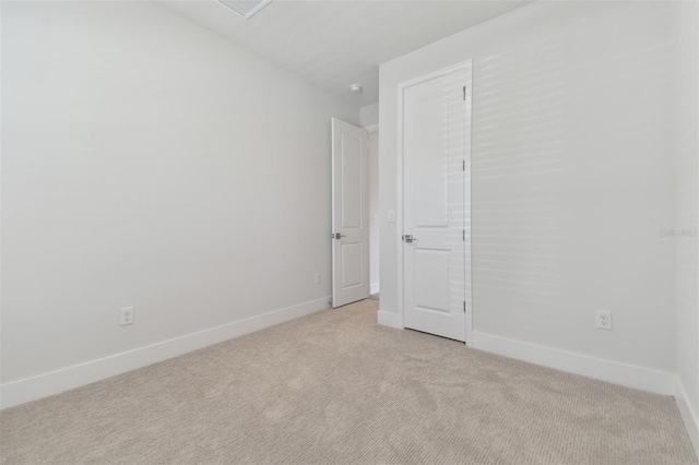 4717 W Mccoy St Unit 2, Tampa, FL 33616 - empty room with light carpet and baseboards
