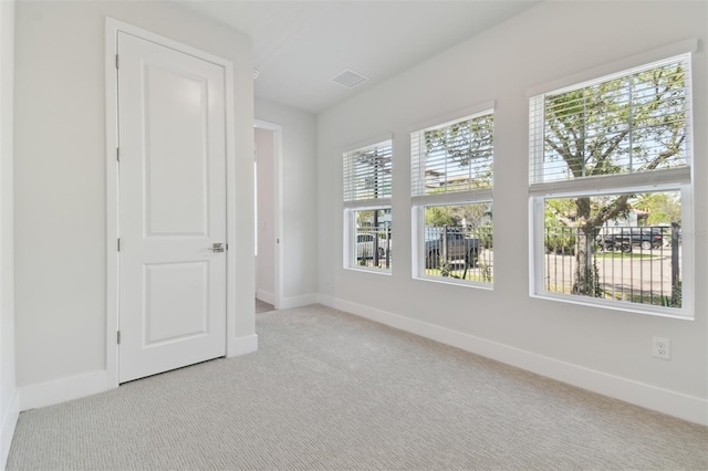 4717 W Mccoy St Unit 2, Tampa, FL 33616 - unfurnished room featuring baseboards and carpet