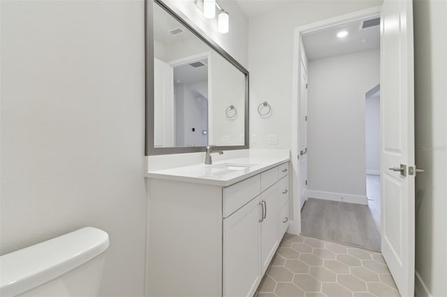 4717 W Mccoy St Unit 2, Tampa, FL 33616 - bathroom with vanity, toilet, and tile patterned flooring