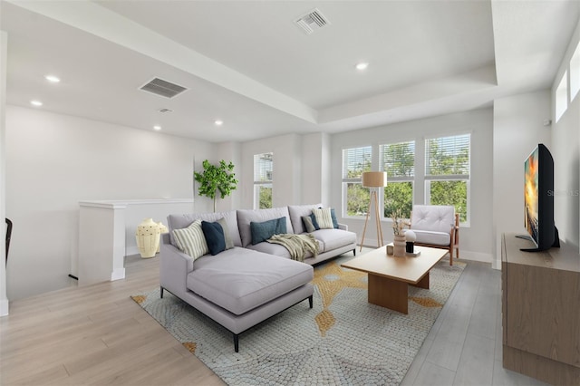 4717 W Mccoy St Unit 2, Tampa, FL 33616 - living area featuring light wood finished floors, recessed lighting, and a tray ceiling