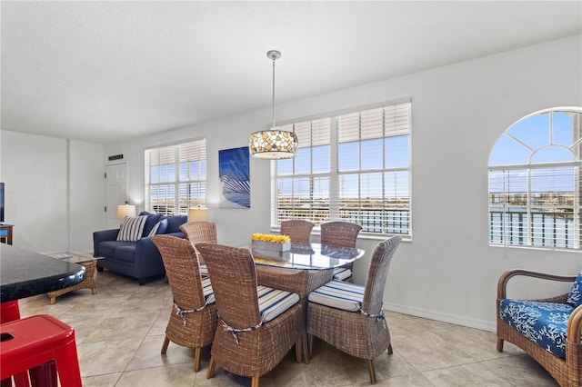 445 Hamden Dr Unit 502, Clearwater Beach, FL 33767 - dining room with light tile patterned floors and baseboards