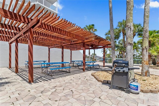 445 Hamden Dr Unit 502, Clearwater Beach, FL 33767 - view of patio / terrace featuring a grill and a pergola