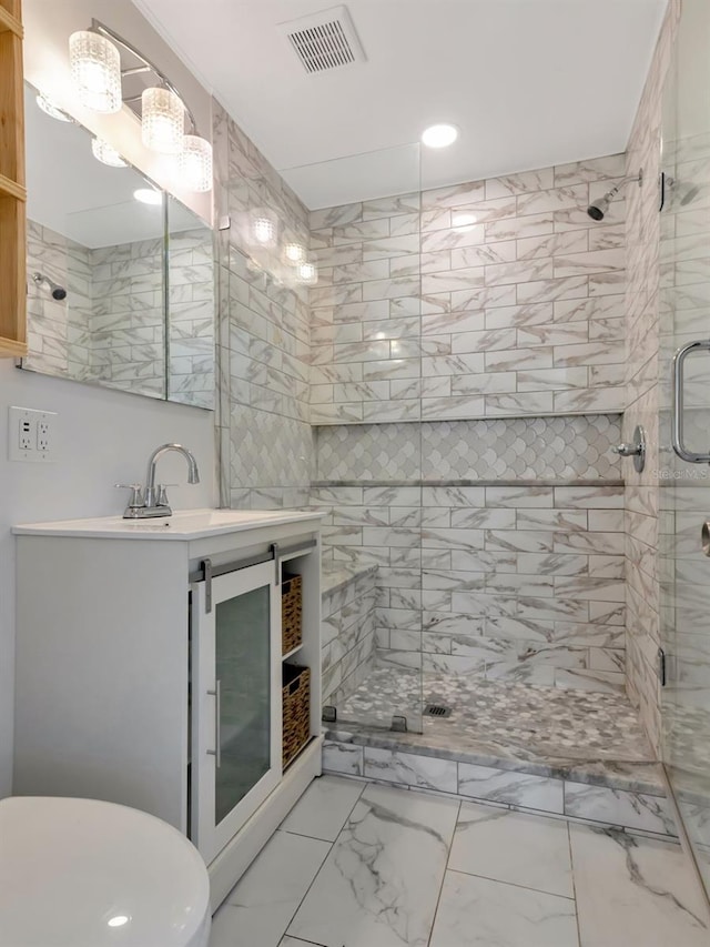 full bathroom featuring visible vents, vanity, marble finish floor, recessed lighting, and a shower stall