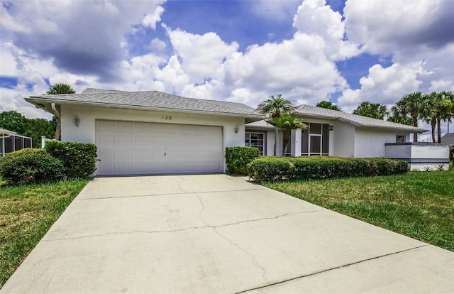 128 Torrington St, Port Charlotte, FL 33954 - ranch-style house with a garage, stucco siding, concrete driveway, and a front yard
