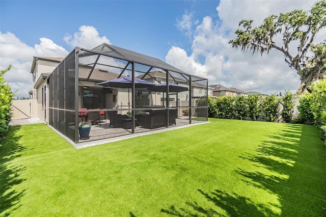 back of house with fence, glass enclosure, and a yard