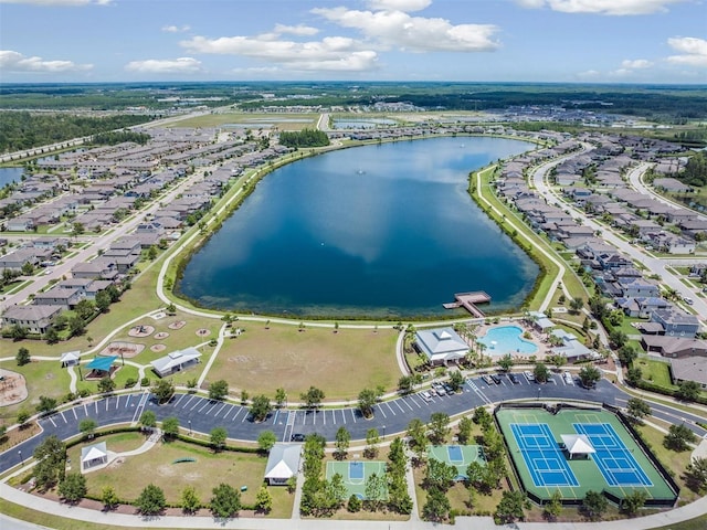 birds eye view of property featuring a water view and a residential view