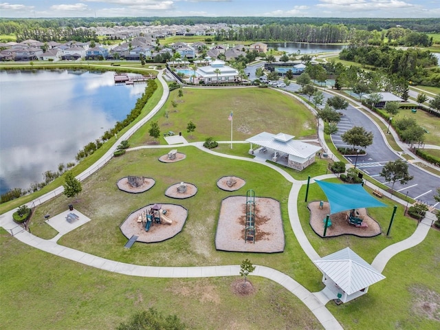 drone / aerial view featuring a water view and a residential view