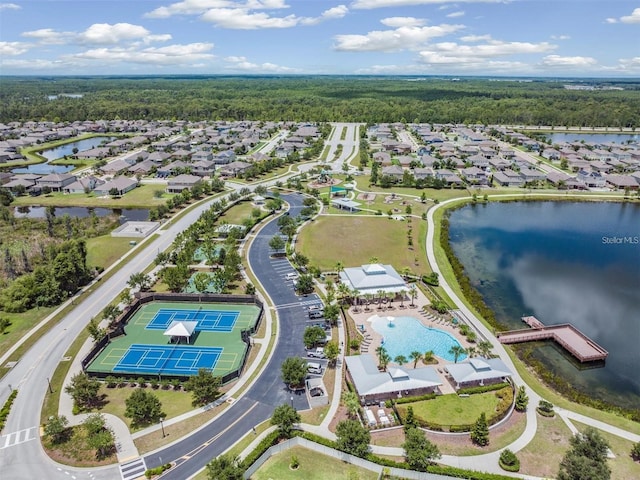 drone / aerial view with a water view and a residential view