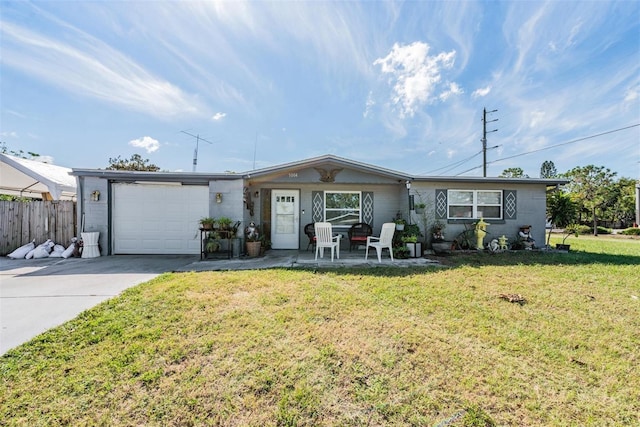 single story home with concrete driveway, fence, a front lawn, and a garage