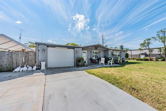 single story home with fence, an attached garage, driveway, and a front lawn