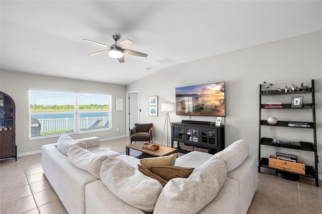 5208 Dandelion St, Apollo Beach, FL 33572 - tiled living room with a ceiling fan, baseboards, visible vents, and vaulted ceiling