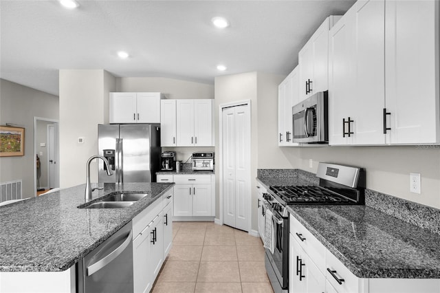 5208 Dandelion St, Apollo Beach, FL 33572 - kitchen with recessed lighting, a sink, white cabinets, and stainless steel appliances
