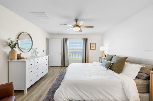 5208 Dandelion St, Apollo Beach, FL 33572 - bedroom with ceiling fan, light wood finished floors, and visible vents