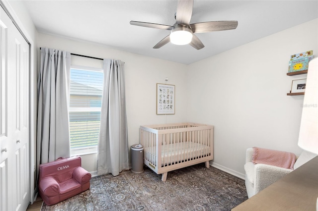 5208 Dandelion St, Apollo Beach, FL 33572 - bedroom featuring a crib, multiple windows, baseboards, and a ceiling fan