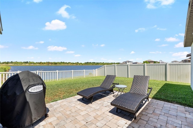 5208 Dandelion St, Apollo Beach, FL 33572 - view of patio with a fenced backyard, a water view, and a grill