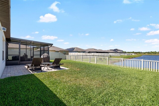 5208 Dandelion St, Apollo Beach, FL 33572 - view of yard featuring a water view, a patio area, a fenced backyard, and a residential view