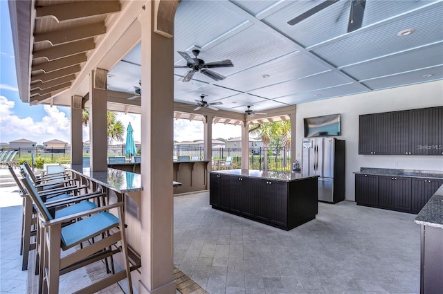 5208 Dandelion St, Apollo Beach, FL 33572 - view of patio featuring fence, outdoor dry bar, and ceiling fan