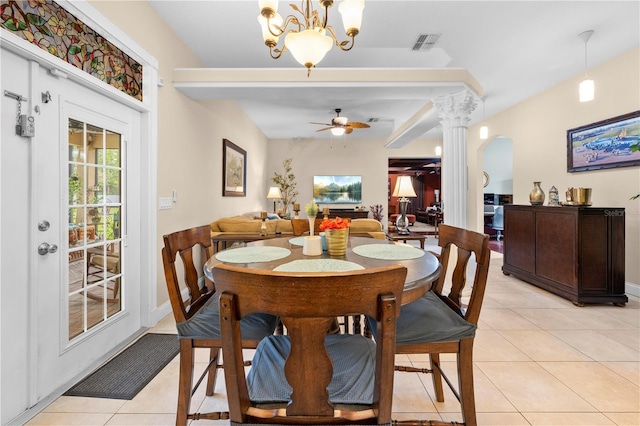 dining room with light tile patterned floors, ceiling fan, a chandelier, decorative columns, and baseboards