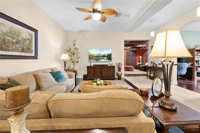 living area with a ceiling fan
