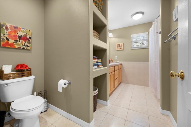 bathroom with tile patterned floors, toilet, and vanity