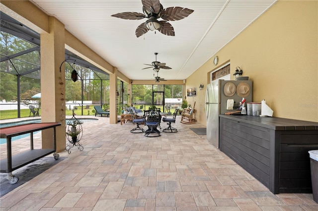 view of patio with an outdoor pool, ceiling fan, outdoor dining space, and glass enclosure