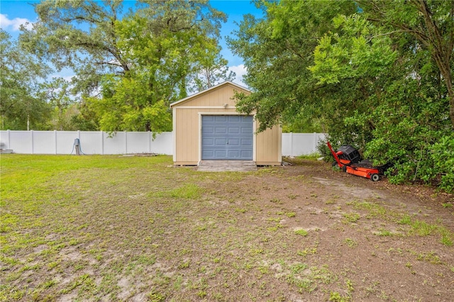 garage featuring a shed