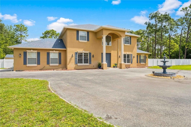 view of front of house featuring stucco siding and asphalt driveway