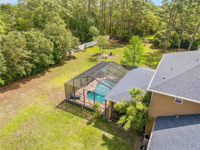 bird's eye view of a pool area and a forest