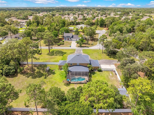 aerial perspective of suburban area featuring a pool