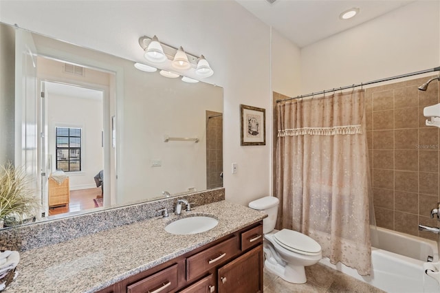 full bath with vanity, toilet, shower / bath combo with shower curtain, and tile patterned flooring