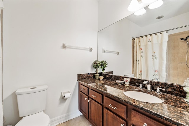 full bathroom featuring toilet, tile patterned floors, curtained shower, and vanity