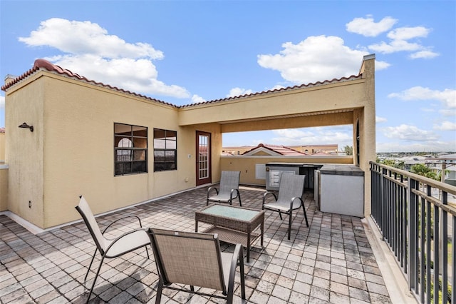 view of patio / terrace with a balcony