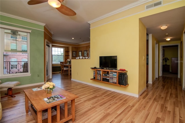 living room with ornamental molding, wood finished floors, baseboards, ceiling fan, and recessed lighting