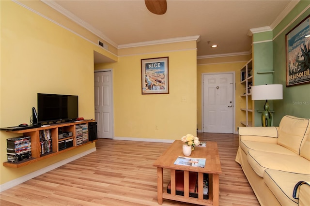 living room featuring crown molding, light wood-style floors, recessed lighting, and baseboards
