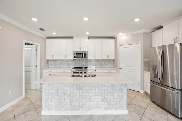 kitchen featuring a sink, ornamental molding, stainless steel appliances, and visible vents