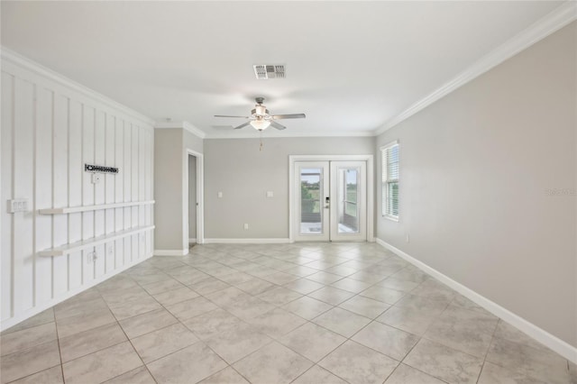 empty room featuring visible vents, ornamental molding, a ceiling fan, and french doors