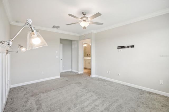 unfurnished room featuring visible vents, ornamental molding, ceiling fan, and carpet flooring