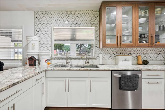 36601 Roberts Rd, Dade City, FL 33525 - kitchen featuring light stone countertops, dishwasher, a sink, glass insert cabinets, and white cabinetry