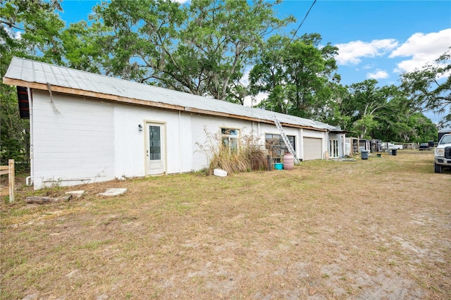 36601 Roberts Rd, Dade City, FL 33525 - back of property with a garage and a yard