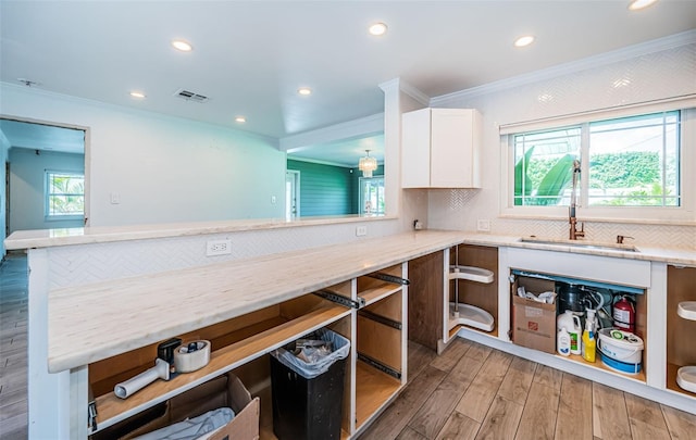 kitchen featuring crown molding, white cabinets, open shelves, and visible vents