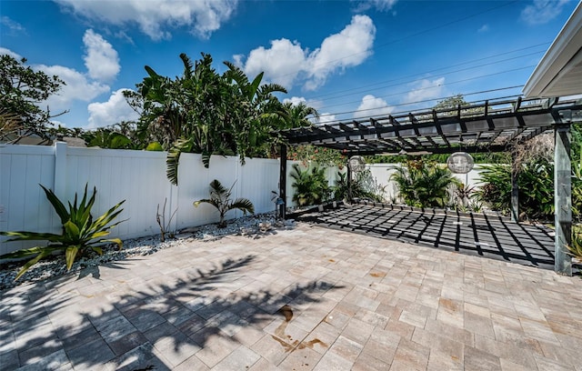 view of patio / terrace with a pergola and a fenced backyard